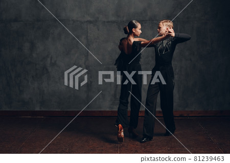 Young couple dancing in ballroom dance Paso doble Young couple dancing in ballroom dance Paso doble 81239463