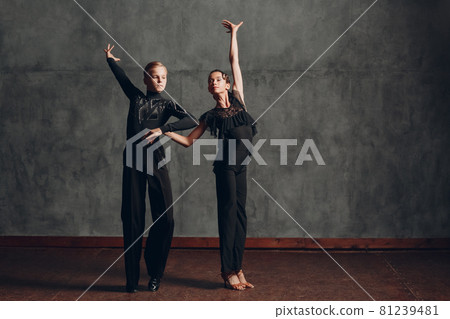 Young couple dancing in ballroom dance Paso doble Young couple dancing in ballroom dance Paso doble 81239481