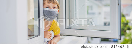 BANNER, LONG FORMAT Extremly tired boy looking out the window, home alone. self-isolation at home, quarantine due to pandemic COVID 19. Mental health problems in self-isolation at home, quarantine 81240246