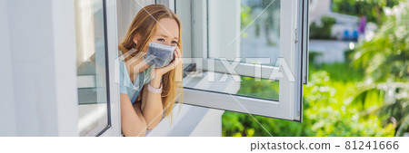 BANNER, LONG FORMAT Extremly tired woman looking out the window, home alone. self-isolation at home, quarantine due to pandemic COVID 19. Mental health problems in self-isolation at home, quarantine 81241666