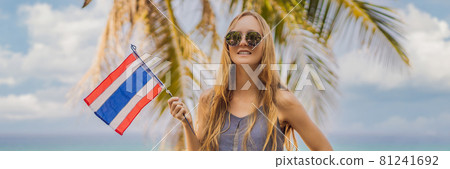 Thailand reopened to tourists after Coronovirus COVID 19 quarantine. Happy woman having fun at the beach with Thailand flag. Beautiful girl enjoying travel to Asia BANNER, LONG FORMAT Thailand reopened to tourists after Coronovirus COVID 19 quarantine. Happy woman having fun at the beach with Thailand flag. Beautiful girl enjoying travel to Asia BANNER, LONG FORMAT 81241692