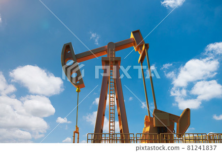 Crude oil pump or oil rig with blue sky Crude oil pump or oil rig with blue sky 81241837
