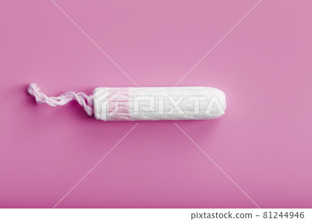 Hygienic tampon on a pink background with a free space 81244946