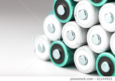 Pyramids of AA batteries on a white background with free space. Pyramids of AA batteries on a white background with free space. 81244952