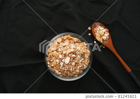 cereal breakfast in bowl on black background cereal breakfast in bowl on black background 81245821