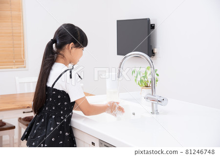 Elementary school girl washing hands 81246748