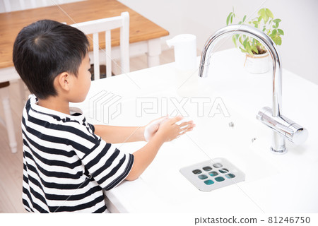 Elementary school boy washing hands 81246750