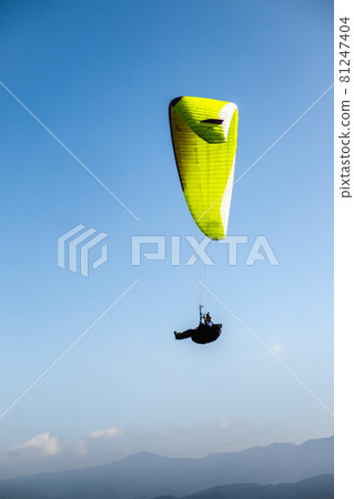 Paraglider flying in the sky Paraglider flying in the sky 81247404