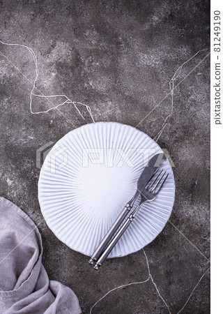 Table setting on grey concrete background Table setting on grey concrete background 81249190