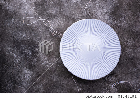 Plate on grey concrete background Plate on grey concrete background 81249191
