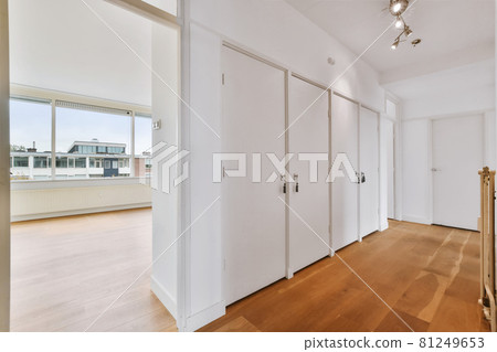 A long empty corridor designed in minimalistic style A long empty corridor designed in minimalistic style 81249653