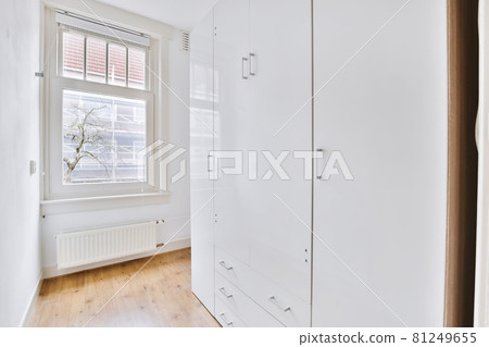 A long empty corridor designed in minimalistic style A long empty corridor designed in minimalistic style 81249655