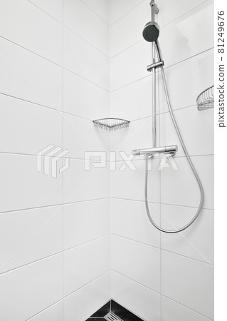 Modern shower stall in a bright bathroom Modern shower stall in a bright bathroom 81249676