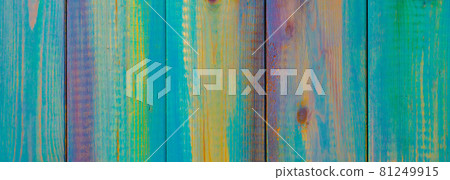 Wooden colored boards abstract background. The texture of the tree. Multi-colored festive backdrop 81249915