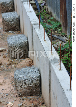 JOHOR, MALAYSIA -JULY 18, 2016: Precast concrete retaining wall at the construction site. JOHOR, MALAYSIA -JULY 18, 2016: Precast concrete retaining wall at the construction site. 81250211