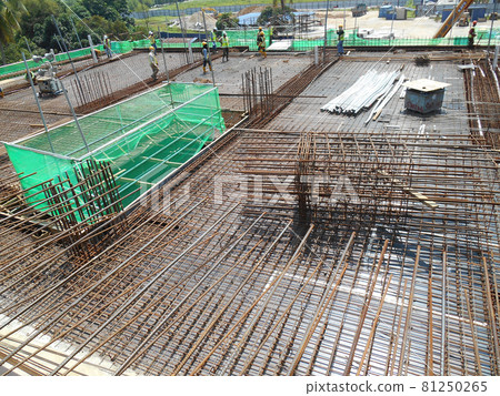 MALACCA, MALAYSIA -JULY 16, 2016: Hot rolled deformed steel bars or steel reinforcement bar at construction site. It is use to strengthen concrete known as reinforcement concrete. MALACCA, MALAYSIA -JULY 16, 2016: Hot rolled deformed steel bars or steel reinforcement bar at construction site. It is use to strengthen concrete known as reinforcement concrete. 81250265