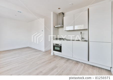 A bright luxury kitchen in an elegant house A bright luxury kitchen in an elegant house 81250371