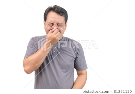 Man covers nose with hand, smells something awful Man covers nose with hand, smells something awful 81251130