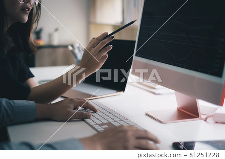 Business team working together and training to analyze technical price graph and indicator. Chart and stock trading computer screen. 81251228