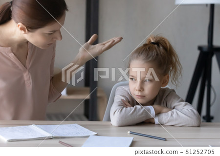 Unhappy mom scold lazy unmotivated daughter studying 81252705
