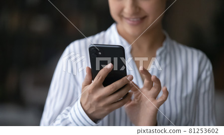 Close up of Indian woman use cellphone gadget 81253602