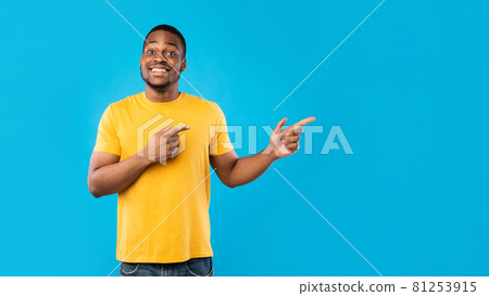 Black Male Pointing Fingers Showing Copy Space Over Blue Background Black Male Pointing Fingers Showing Copy Space Over Blue Background 81253915