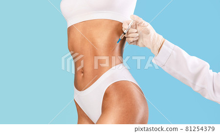 Woman having lipolysis treatment at beauty salon Woman having lipolysis treatment at beauty salon 81254379