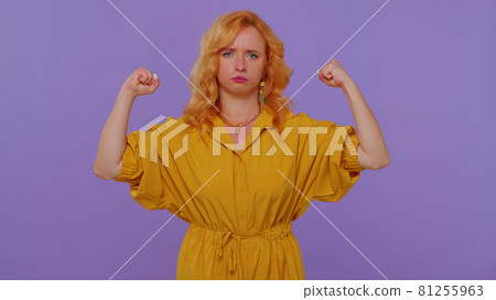 Girl showing biceps, feeling power strength to fight for rights, energy to gain success win fight 81255963