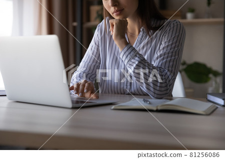 Close up of woman work on laptop at home office 81256086