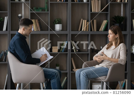 Woman tells about personal problems to counselor during individual session 81256090