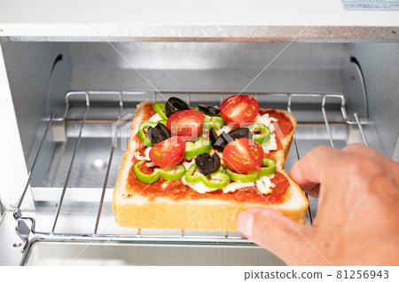 Put homemade pizza toast in a toaster Put homemade pizza toast in a toaster 81256943