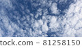 Autumn blue sky with muffled clouds flowing slowly 81258150
