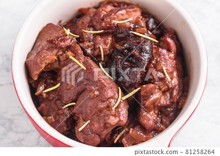 Chicken and prunes stewed in red wine Chicken and prunes stewed in red wine 81258264
