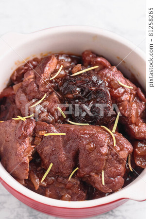 Chicken and prunes stewed in red wine Chicken and prunes stewed in red wine 81258265
