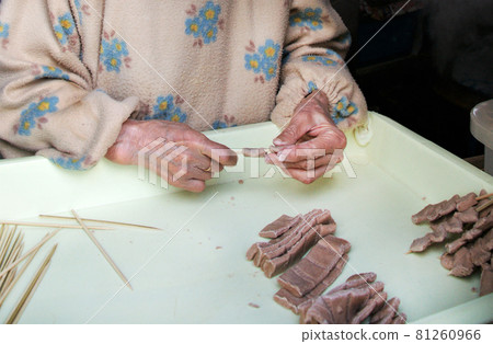 Woman making kibi dango 81260966