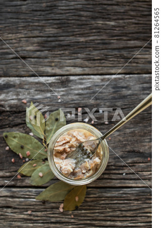 Stew in a glass jar on a wooden table. Preservation and storage of products. Farm organic food. 81264565