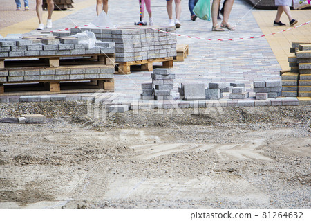 Process of construction of brick paved sidewalk, half built pavement road Process of construction of brick paved sidewalk, half built pavement road 81264632
