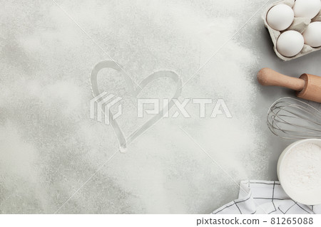 Baking concept flat lay. Ingredients, kitchen utensils, grey concrete background 81265088