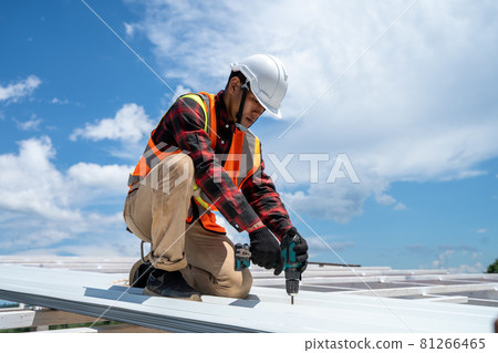 Roofing,Construction workers wearing safety harness checking and installation assembly of new roof. 81266465