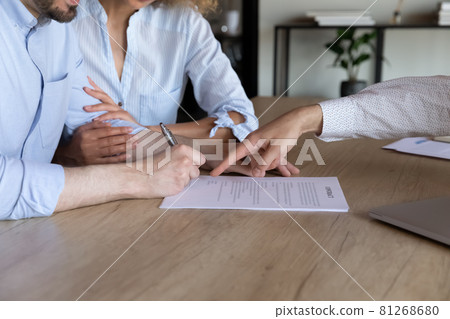 Close up of couple close deal at meeting in office Close up of couple close deal at meeting in office 81268680