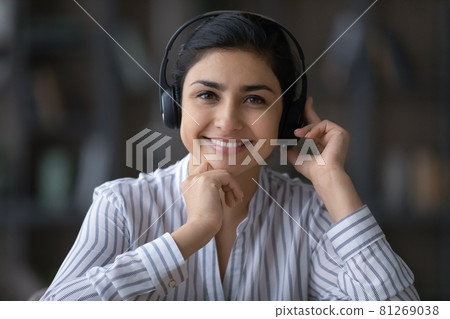 Headshot portrait of smiling Indian woman talk on webcam call Headshot portrait of smiling Indian woman talk on webcam call 81269038