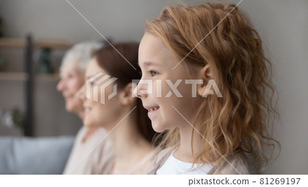 Smiling three generations of women show family unity Smiling three generations of women show family unity 81269197