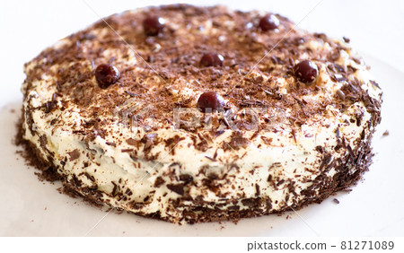 Chocolat and cream cake (black forest cake) with cherries on a white background. Chocolat and cream cake (black forest cake) with cherries on a white background. 81271089