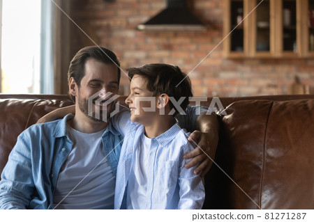 Smiling young father relax at home with small son 81271287