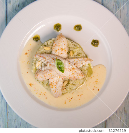 Baked sole fillet, risotto and pesto recipe Baked sole fillet, risotto and pesto recipe 81276219