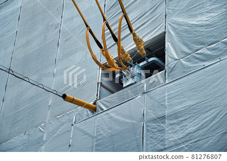 Scaffolding and electrical wire protection pipes installed in difficult locations 81276807