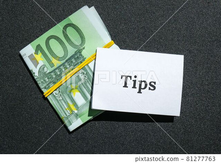 Euro bills, savings ins, money. Paper note written word TIPS. Business budget of wealth Euro bills, savings ins, money. Paper note written word TIPS. Business budget of wealth 81277763