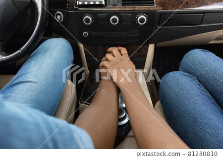Cropped of afro american man and woman sitting in car 81280810