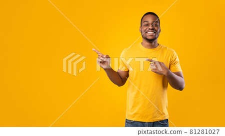Cheerful African Man Pointing Fingers Aside Over Yellow Background, Panorama 81281027