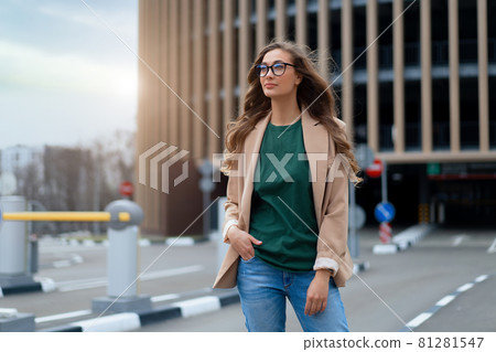 Business Woman Standing Near Indoor Parking Garage Business Woman Standing Near Indoor Parking Garage 81281547